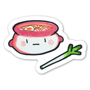 A yummy pot of boiling ramen with a leek. 