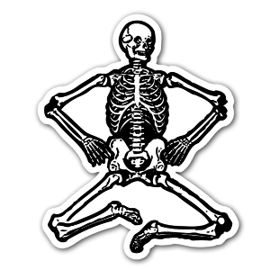 A black and white skeleton sitting.