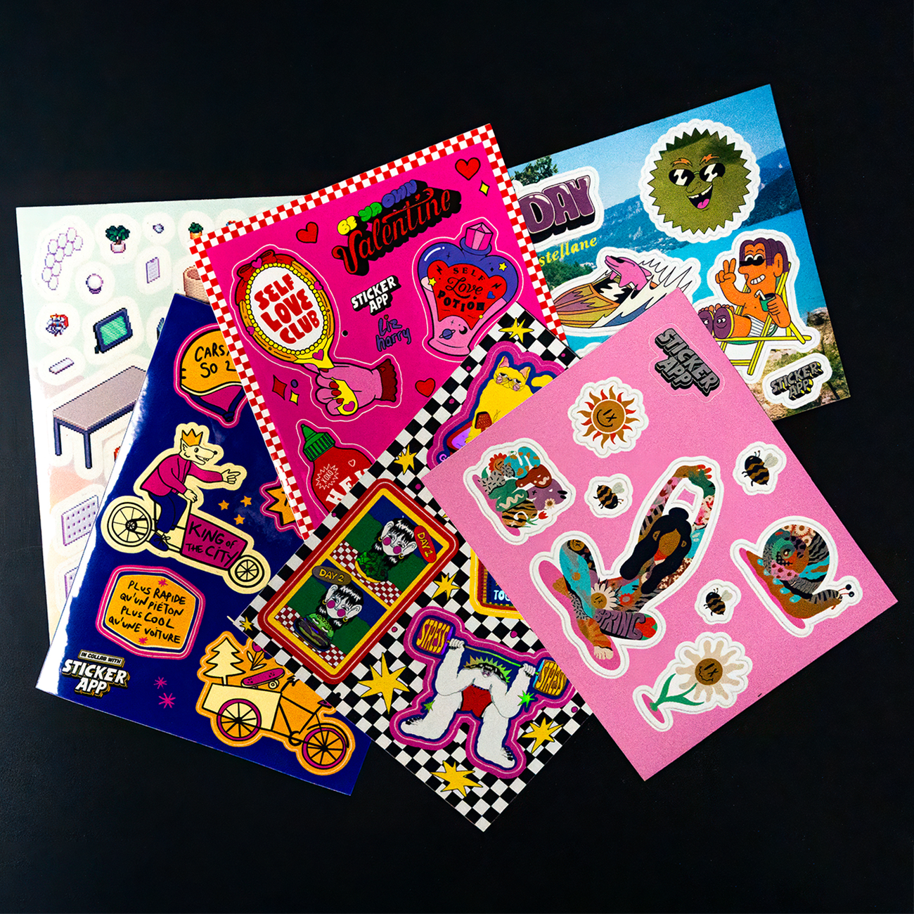 Several colorful sticker sheets featuring playful illustrations, characters, and graphic designs