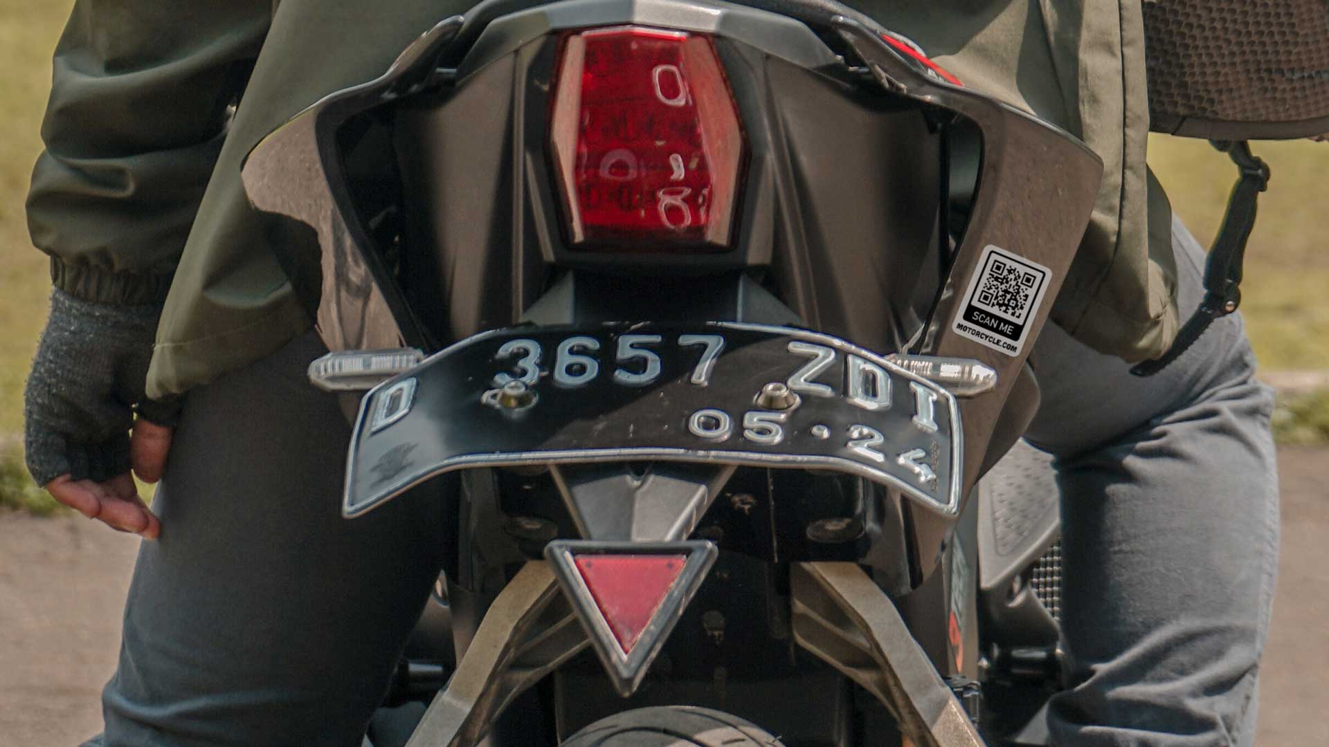 Custom QR code sticker on a motorcycle.